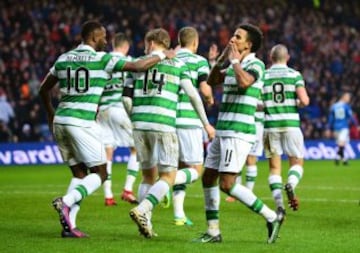 Scott Sinclair (L) of Celtic celebrates scoring his team's second goal during the Ladbrokes Scottish Premiership match between Rangers and Celtic at Ibrox Stadium on December 31, 2016 