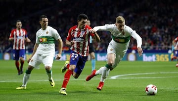 Gaitán (centre) has endured an underwhelming spell at Atlético.