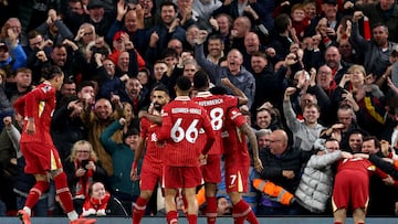 Liverpool's Egyptian striker #11 Mohamed Salah (2l) celebrates scoring the team's second goal during the English Premier League football match between Liverpool and Brighton and Hove Albion at Anfield in Liverpool, north west England on November 2, 2024. (Photo by Darren Staples / AFP) / RESTRICTED TO EDITORIAL USE. No use with unauthorized audio, video, data, fixture lists, club/league logos or 'live' services. Online in-match use limited to 120 images. An additional 40 images may be used in extra time. No video emulation. Social media in-match use limited to 120 images. An additional 40 images may be used in extra time. No use in betting publications, games or single club/league/player publications. /
