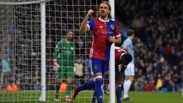 Basel&#039;s Swiss defender Michael Lang celebrates scoring their second goal during the UEFA Champions League round of sixteen second leg football match between Manchester City and Basel at the Etihad Stadium in Manchester, north west England, on March 7