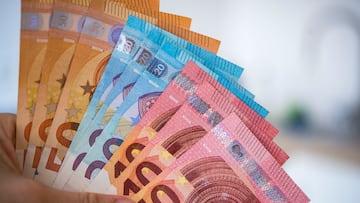 04 December 2018, Saxony, Dresden: ILLUSTRATION - A woman holds banknotes of 10, 20 and 50 euros in her hand (staged scene). Photo: Monika Skolimowska/dpa-Zentralbild/ZB (Photo by Monika Skolimowska/picture alliance via Getty Images)