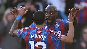 Crystal Palace's French striker #14 Jean-Philippe Mateta (R) celebrates with Crystal Palace's Colombian defender #12 Daniel Munoz (L) after scoring the opening goal of the English Premier League football match between Crystal Palace and Tottenham Hotspur at Selhurst Park in south London on October 27, 2024. (Photo by HENRY NICHOLLS / AFP) / RESTRICTED TO EDITORIAL USE. No use with unauthorized audio, video, data, fixture lists, club/league logos or 'live' services. Online in-match use limited to 120 images. An additional 40 images may be used in extra time. No video emulation. Social media in-match use limited to 120 images. An additional 40 images may be used in extra time. No use in betting publications, games or single club/league/player publications. / (Photo by HENRY NICHOLLS/AFP via Getty Images)