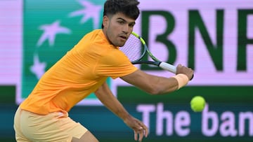 Mar 7, 2026; Indian Wells, CA, USA; Carlos Alcaraz (ESP) hits a shot as he defeated Grigor Dimitrov (BUL) during his second round match in the BNP Paribas Open at the Indian Wells Tennis Garden. Mandatory Credit: Jayne Kamin-Oncea-Imagn Images