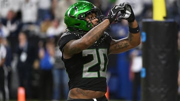 Dec 7, 2024; Indianapolis, IN, USA; Oregon Ducks running back Jordan James (20) reacts after rushing for a touchdown against the Penn State Nittany Lions during the fourth quarter in the 2024 Big Ten Championship game at Lucas Oil Stadium. Mandatory Credit: Robert Goddin-Imagn Images