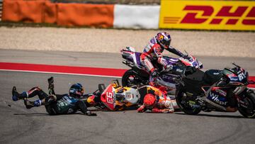 PORTIMAO, ALGARVE, PORTUGAL - MARCH 26: Marc Marquez of Spain and Repsol Honda Team crashed with local hero Miguel Oliveira of Portugal and CryptoDATA RNF MotoGP Team during the race of the MotoGP Grande Prémio TISSOT de Portugal  at Autodromo do Algarve on March 26, 2023 in Portimao, Algarve, Portugal. (Photo by Steve Wobser/Getty Images)