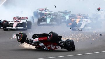 NORTHAMPTON, ENGLAND - JULY 03: Zhou Guanyu of China driving the (24) Alfa Romeo F1 C42 Ferrari crashes at the start during the F1 Grand Prix of Great Britain at Silverstone on July 03, 2022 in Northampton, England. (Photo by Mark Thompson/Getty Images)