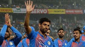 Indian bowler Ashish Nehra (C) waves at supporters as he leaves the field with his team at the end of the first T20 cricket match between New Zealand and India at Feroz Shah Kotla Cricket Stadium in New Delhi, on November 1, 2017.
 Ashish Nehra played his