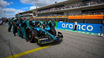 FILE PHOTO: Oct 23, 2022; Austin, Texas, USA; The crew of Aston Martin driver Sebastian Vettel (5) wheel their car onto the grid before the start of the U.S. Grand Prix at Circuit of the Americas. Mandatory Credit: Jerome Miron-USA TODAY Sports/File Photo
