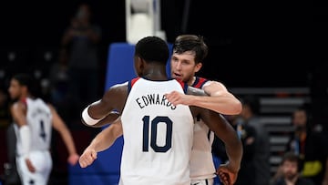 USA�s Austin Reaves (R) hugs Anthony Edwards (L) after their victory during the FIBA Basketball World Cup group J match between USA and Montenegro at Mall of Asia Arena in Pasay, Metro Manila on September 1, 2023. (Photo by JAM STA ROSA / AFP)