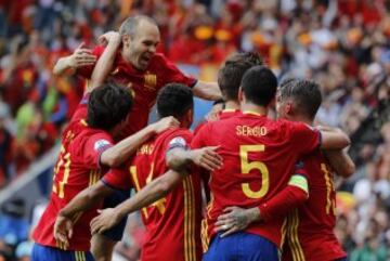 Piqué is mobbed by his Spain team-mates.