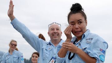 Australian Medical Assistance Team (AUSMAT) staff who worked with the passengers and crew on the cruise ship MV Artania wave goodbye as it departs Fremantle Fremantle harbour, in Fremantle. 