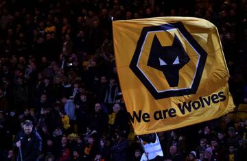 Wolves fans fly a giant flag ahead of the English FA Cup third round football match between Wolverhampton Wanderers and Liverpool at the Molineux stadium in Wolverhampton, central England on January 7