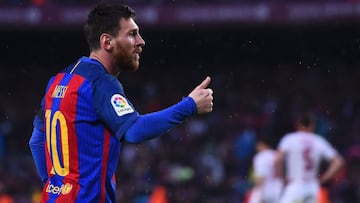 Barcelona's Argentinian forward Lionel Messi gestures as he celebrates his goal during the Spanish league football match FC Barcelona vs Sevilla FC at the Camp Nou stadium in Barcelona on April 5, 2017. / AFP PHOTO / Josep LAGO