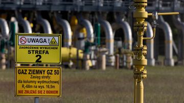 FILE PHOTO: Warning signs are pictured in front of the gas compressor station, a part of Polish section of the Yamal pipeline that links Russia with western Europe which is owned by a joint venture of Gazprom and PGNiG but it is operated by Poland's state-owned gas transmission company Gaz-System, in Gabinek near Wloclawek, Poland May 23, 2022. The signs read: "Attention! Explosion risk. Zone 2" and "Natural gas. Keep fire away." REUTERS/Kacper Pempel/File Photo