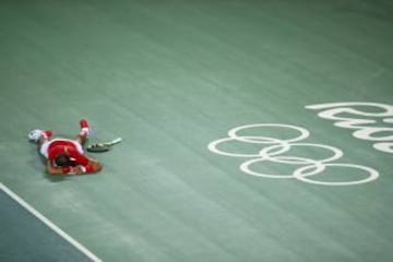 RIO DE JANEIRO, BRAZIL - AUGUST 12: Rafael Nadal of Spain celebrates match point in the Men's Doubles Gold medal match with Marc Lopez of Spain against Horia Tecau and Florin Mergea of Romania on Day 7 of the Rio 2016 Olympic Games at the Olympic Tennis C