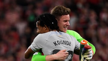 Barcelona's German goalkeeper Marc-Andre ter Stegen and Barcelona's French defender Jules Kounde (L) celebrate victory at the end of the Spanish league football match between Athletic Club Bilbao and FC Barcelona at the San Mames stadium in Bilbao on March 12, 2023. - FC Barcelona won 0-1. (Photo by ANDER GILLENEA / AFP)