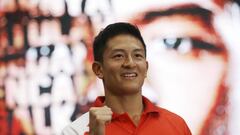 Rio Haryanto, the first Indonesian Formula One driver, poses for photographers during a press conference in Jakarta, Indonesia, Thursday, Feb. 18, 2016. F1 team Manor has appointed Rio Haryanto as one of its race drivers for the coming season.