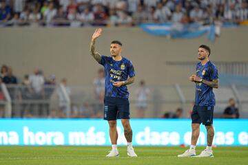 Argentina midfielders Leandro Paredes (L) and Rodrigo De Paul greet the crowd before the start of the friendly football match between Argentina and Panama at the Monumental stadium in Buenos Aires, on March 23, 2023. 