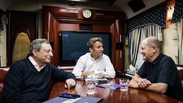 UNSPECIFIED, UKRAINE - JUNE 16: In this handout photo provided by the German Government Press Office (BPA), (L-R) Italy's Prime Minister Mario Draghi, France's President Emmanuel Macron and German Chancellor Olaf Scholz (SPD) sit on a night train traveling to Kyiv on June 16, 2022 in Ukraine. The leaders made their first visits to Ukraine since the country was invaded by Russia on February 24th. (Photo by Jesco Denzel/Getty Images via Bundesregierung)