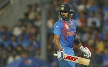 India's Virat Kohli walks off the field after his dismissal.