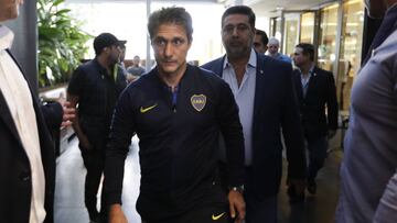 Boca Juniors' coach Guillermo Barros Schelotto, front, and Boca Juniors' President Daniel Angelici arrive to give a press conference in Buenos Aires, Argentina, Sunday, Nov. 25, 2018, after the Copa Libertadores final between rivals Boca Juniors and River Plate was once again suspended. The same decision was made on Saturday after Boca’s bus was attacked by River fans. (AP Photo/Natacha Pisarenko)