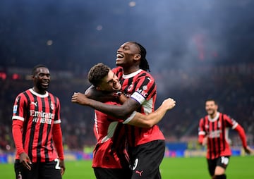 Christian Pulisic celebrates scoring Milan's third goal with Rafael Leão.