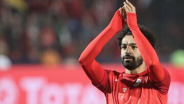 FILED - 06 July 2019, Egypt, Cairo: Egypt's Mohamed Salah greets supporters during the warm up prior to the start of the 2019 Africa Cup of Nations round of 16 soccer match between Egypt and South Africa at Cairo International Stadium. Egypt's h