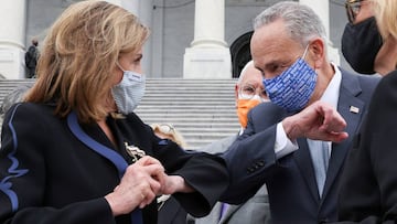 House Speaker Nancy Pelosi and Senate Minority Leader Chuck Schumer share an elbow greeting following ceremonies honoring late Supreme Court Justice Ruth Bader Ginsburg at the US Capitol in Washington.