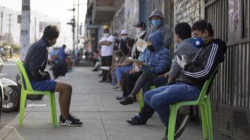 LIMA, PERU - APRIL 24: People make a line to receive aid from the government during coronavirus lockdown on April 24, 2020 in Lima, Peru. After 40 days of government-ordered lockdown and over 20,000 positive cases registered, President Vizcarra extended p