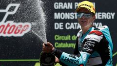 Leopard Racing&#039;s Spanish rider Marcos Ramirez celebrates on the podium afer winning the Catalunya Moto3 Grand Prix race at the Catalunya racetrack in Montmelo, near Barcelona, on June 16, 2019. (Photo by PAU BARRENA / AFP)