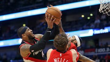 Nov 19, 2019; New Orleans, LA, USA; Portland Trail Blazers forward Carmelo Anthony (00) shoots defended by New Orleans Pelicans forwards Brandon Ingram (14) and Nicolo Melli (20) in the second half at the Smoothie King Center. Mandatory Credit: Chuck Cook-USA TODAY Sports