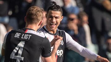 Juventus&#039; Portuguese forward Cristiano Ronaldo (R) congratulates Juventus&#039; Dutch defender Matthijs de Ligt after de Ligt scored during the Italian Serie A football match Juventus vs Fiorentina on February 2, 2020 at the Juventus Allianz stadium 