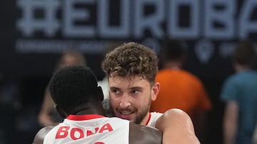 Turkey's power forward #23 Alperen Sengun (R) and Turkey's power forward #30 Adem Bona celebrate the win after the FIBA EuroBasket 2025 quarter-final basketball match between Turkey and Poland in Riga, Latvia, on September 9, 2025. (Photo by Gints Ivuskans / AFP)