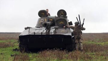 Ukrainian soldiers prepare to fire shells on a 2S1 Gvozdika tank on the front line in Donetsk region on October 10, 2022 as Russian forces launched earlier today at least 75 missiles at Ukraine, with fatal strikes targeting the capital Kyiv, and cities in the south and west. (Photo by Anatolii STEPANOV / AFP) (Photo by ANATOLII STEPANOV/AFP via Getty Images)