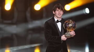 Messi with his 2010 Ballon d'Or