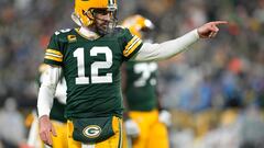 GREEN BAY, WISCONSIN - JANUARY 08: Aaron Rodgers #12 of the Green Bay Packers reacts after throwing a touchdown pass during the third quarter against the Detroit Lions at Lambeau Field on January 08, 2023 in Green Bay, Wisconsin.   Patrick McDermott/Getty Images/AFP (Photo by Patrick McDermott / GETTY IMAGES NORTH AMERICA / Getty Images via AFP)