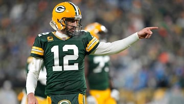 GREEN BAY, WISCONSIN - JANUARY 08: Aaron Rodgers #12 of the Green Bay Packers reacts after throwing a touchdown pass during the third quarter against the Detroit Lions at Lambeau Field on January 08, 2023 in Green Bay, Wisconsin.   Patrick McDermott/Getty Images/AFP (Photo by Patrick McDermott / GETTY IMAGES NORTH AMERICA / Getty Images via AFP)