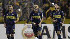 Argentina&#039;s Boca Juniors forward Dario Benedetto (C) celebrates next to teammates forward Carlos Tevez (L) and Uruguayan midfielder Nahitan Nandez after shooting a penalty kick to score his team&#039;s second goal, against Bolivia&#039;s Wilstermann during the Copa Libertadores 2019 group G football match at the &quot;Bombonera&quot; stadium in Buenos Aires, Argentina, on April 10, 2019. Boca won 4-0. - Boca won 4-0. (Photo by JUAN MABROMATA / AFP)