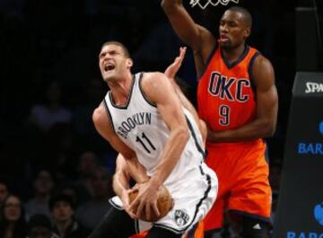 Jan 24, 2016; Brooklyn, NY, USA; Oklahoma City Thunder forward Serge Ibaka (9) and forward Nick Collison (behind Lopez) defend against Brooklyn Nets center Brook Lopez (11) during first half at Barclays Center. Mandatory Credit: Noah K. Murray-USA TODAY Sports