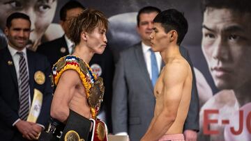 South Korea's Kim Ye-joon (R) and Japan's Naoya Inoue (L) pose during the official weigh-in ahead of their world super-bantamweight title boxing bout in Yokohama on January 23, 2025. (Photo by Philip FONG / AFP)