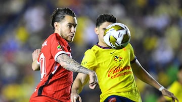 Jesus Angulo (L) of Toluca fights for the ball with Israel Reyes (R) of America during the Quarter final first leg round match between America and Toluca as part of the Liga BBVA MX, Torneo Apertura 2024 at Ciudad de los Deportes Stadium on November 27, 2024 in Mexico City, Mexico.