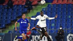 GETAFE, SPAIN - FEBRUARY 27: Mouctar Diakhaby of Valencia CF heads to safety as Jaime Mata of Getafe CF gives chase during the La Liga Santander match between Getafe CF and Valencia CF at Coliseum Alfonso Perez on February 27, 2021 in Getafe, Spain. Sport