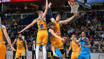 BERLIN, GERMANY - JANUARY 30: (L-R) Anzejs Pasecniks of Herbalife Gran Canaria, Marius Grigonis of Alba Berlin and Nicolas Brussino of Herbalife Gran Canaria during the game between Alba Berlin and Herbalife Gran Canaria on January 30, 2018 in Berlin, Germany. (Photo by Florian Pohl/City-Press via Getty Images)