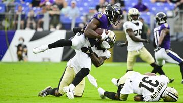 Aug 14, 2021; Baltimore, Maryland, USA; New Orleans Saints safety Chauncey Gardner-Johnson (22) talks Baltimore Ravens wide receiver Devin Duvernay (13) during the first quarter at M&T Bank Stadium. Mandatory Credit: Tommy Gilligan-USA TODAY Sports