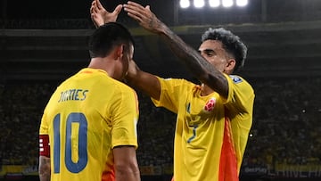 Colombia's midfielder #10 James Rodriguez celebrates scoring his team's first goal with forward #07 Luis Diaz during the 2026 FIFA World Cup South American qualifiers football match between Colombia and Bolivia at the Roberto Melendez Metropolitan stadium in Barranquilla, Colombia on September 4, 2025. (Photo by Luis ACOSTA / AFP)