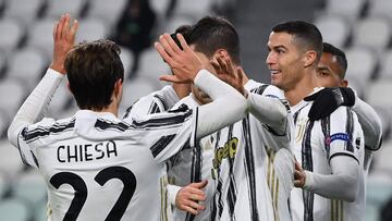 Juventus' Portuguese forward Cristiano Ronaldo (R) celebrates after scoring during the UEFA Champions League Group G football match Juventus vs Dynamo Kiev on December 2, 2020 at the Juventus stadium in Turin. (Photo by Vincenzo PINTO / AFP)