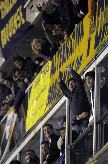 Diego Armando Maradona supporting Boca Juniors at La Bombonera.