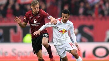 (FILES) In this file photo taken on March 2, 2019, Nuernberg's German midfielder Hanno Behrens (L) and Leipzig's US midfielder Tyler Adams (R) vie for the ball during the German first division Bundesliga football match 1 FC Nuremberg vs RB Leipzig in Nuremberg, Germany. - Bundesliga-based players Christian Pulisic, Weston McKennie and Adams were named in the United States squad for upcoming friendlies against Ecuador and Chile on March 12, 2019, as new coach Gregg Berhalter builds towards this year's CONCACAF Gold Cup. (Photo by Christof STACHE / AFP) / DFL REGULATIONS PROHIBIT ANY USE OF PHOTOGRAPHS AS IMAGE SEQUENCES AND/OR QUASI-VIDEO