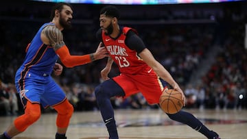 NEW ORLEANS, LOUISIANA - DECEMBER 12: Anthony Davis #23 of the New Orleans Pelicans drives the ball around Steven Adams #12 of the Oklahoma City Thunder at Smoothie King Center on December 12, 2018 in New Orleans, Louisiana. NOTE TO USER: User expressly acknowledges and agrees that, by downloading and or using this photograph, User is consenting to the terms and conditions of the Getty Images License Agreement.   Chris Graythen/Getty Images/AFP
 == FOR NEWSPAPERS, INTERNET, TELCOS &amp; TELEVISION USE ONLY ==