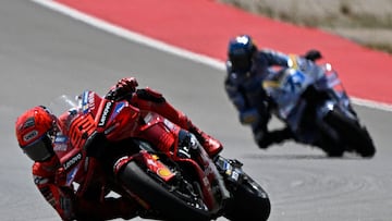 Team Ducati Lenovo Team's Marc Marquez rides ahead of Team Gresini Racing MotoGP's Alex Marquez (R) during the sprint race of the MotoGP Aragon Grand Prix at the Motorland circuit in Alcaniz, northeastern Spain, on June 7, 2025. (Photo by JOSE JORDAN / AFP)